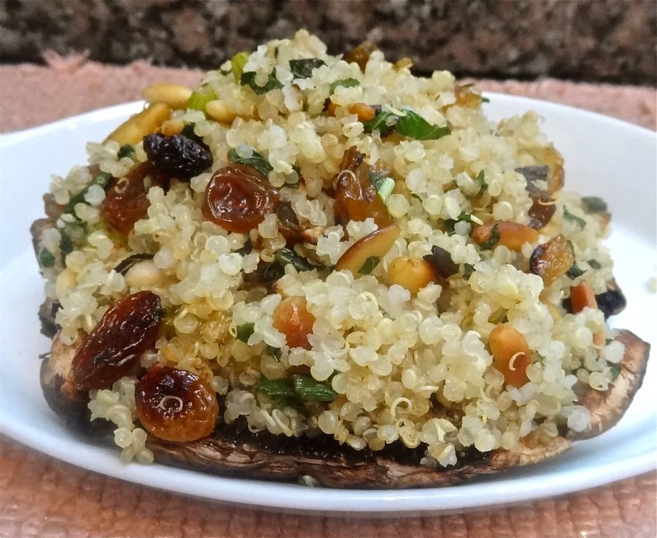 Quinoa Stuffed Portobello Mushroom Caps with Raisins and Pine Nuts